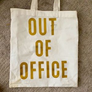Canvas tote says “out of office on both sides”